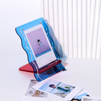 Vente en gros Nouveau cadre photo de table pendule magnétique transparent en acrylique avec cadre photo couleur design en dentelle ondulée