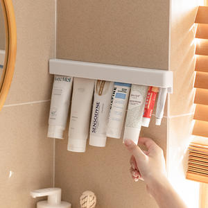 Estante de almacenamiento de clip de pared para baño en casa para pasta de dientes y limpiador facial artefacto elegante sin perforar - Product Image 5