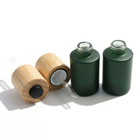 Flacon compte-gouttes en verre avec bouton-poussoir en bambou personnalisé de luxe avec couvercle en bambou pour l'emballage d'huiles essentielles, de sérums et de cosmétiques