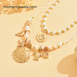 Collier Charme Océan Doré avec Pendentifs Étoile de Mer, Dauphin, Coquillage, Tortue et Perle – Bijou Marin Tendance pour Femme, Style Plage - Product Image 1