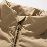 Veste en duvet d'hiver de haute qualité pour hommes avec poche zippée col montant personnalisée couleur unie coupe ample grande taille processus tricoté