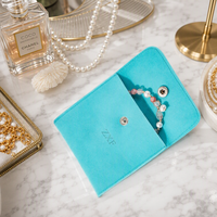 Pochette à bijoux en microfibre de velours bleu lac de luxe personnalisée ZXF de haute qualité avec bouton et insert logo