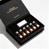 Boîte cadeau rigide noire sur mesure avec fermeture magnétique, logo estampé à chaud or, insert en mousse EVA pour 9 bouteilles de boisson au collagène et peptides.