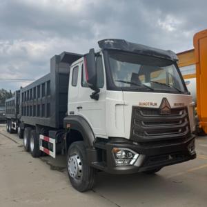 Camion benne d'occasion Sinotruk HOWO NX 6x4 10 roues à châssis large avec options de pneus tout-terrain pour routes minières spécifiques - Product Image 1