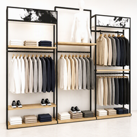 Présentoir mural multi-emplacements en métal noir pour vêtements, avec plateforme pour mannequin et étagère en bois, usage commercial