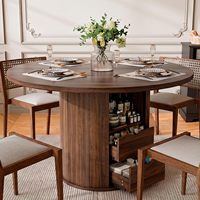 Table à manger ronde en noyer de 47 pouces avec base de rangement intégrée et 2 tiroirs, design à lattes de bois pour cuisine et appartement.