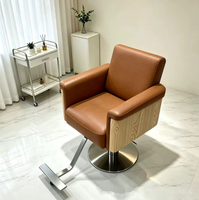 Chaise de barbier ergonomique en cuir de style moderne avec levage rotatif et repose-pieds réglable pour salons de coiffure - Vente directe d'usine