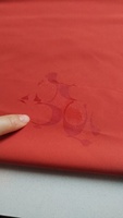 Tissu tissé 100% polyester 113 g/m², révèle un motif imprimé lorsqu'il est exposé à l'eau, idéal pour les vestes, les manteaux, les vêtements de sport et les vêtements de travail