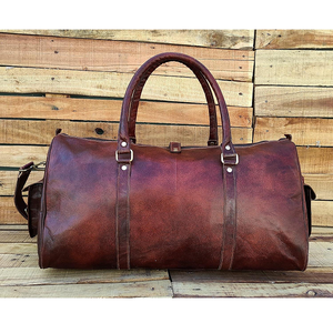 L'aventure vous attend avec un sac de voyage 100 % cuir véritable, conçu pour un emballage spacieux et une durabilité accrue. - Product Image 4