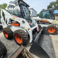 Chargeuse compacte Bobcat S18 d'occasion en bon état avec godet et divers accessoires disponibles