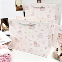 Sacs cadeaux en papier recyclable rose avec poignée en corde pour l'emballage des bougies