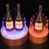Vente directe haut de gamme illuminé acrylique LED casier à vin présentoir créatif pour comptoir de bar étagère à liqueur de luxe