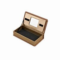 Boîte cadeau biodégradable en carton personnalisée en forme de livre avec fermeture magnétique, logo estampé à chaud, détails de couture, miroir intégré et éponge
