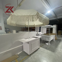 Carrito de Dulces Elegante ZKAI para Decoración de Fiestas, Exhibición de Alimentos y Golosinas, con Soporte para Sombrilla, de PVC y Acrílico, con Ruedas