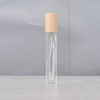 Flacons de parfum en verre de 10 ml, forme cylindrique carrée transparente, avec pompe pulvérisatrice en aluminium argenté et bouchon en bois de hêtre et de noyer, pour voyage.
