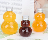 Nouveau design 100ml 200ml 300ml Vase en plastique à double gourde en forme de bouteille de boisson de jus d'animal familier