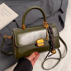 PU Leather Handbag with <b>Strap</b> <b>Buckle</b> and Metal Clasp Shoulder and Crossbody Design - Product Image 4