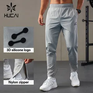 Hucai Custom Heren Premium Nylon Spandex Lichtgewicht Sport Siliconen Logo Vier-Weg Stretch Sneldrogende Fitness Gym Jogger Mannen