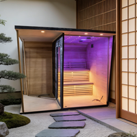 Sauna extérieur moderne en bois de cèdre noir imprimé pour 2 à 6 personnes, avec poêle à vapeur et pierres volcaniques, idéal pour villa ou parc.