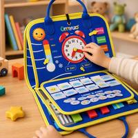 Tableau d'activités sensorielles portable en tissu doux pour tout-petits, idéal pour les voyages, pour développer la motricité et les compétences de base - Busy Board