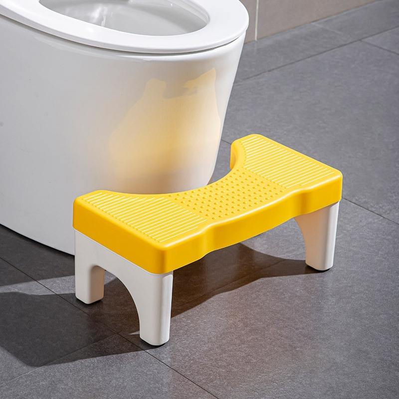 Stool with yellow top and white feet