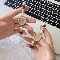 Montre à quartz pour femme NYY avec cordon tressé à perles étoiles mignonnes, cordon de serrage réglable, design écologique en cristal acrylique