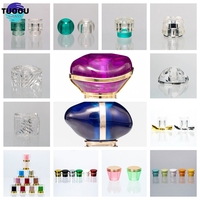 TUOOU Stock, venta al por mayor, tapa de botella de Perfume de lujo, tapa de plástico serpentina especialmente diseñada, cierre suave para sellado de envases