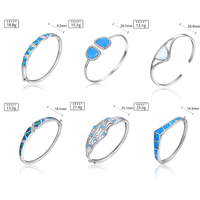 Bracelet en opale enchanteur en argent 925: le feu pastel brille dans la pierre, encadré par de l'argent, la beauté qui bouge à chaque geste