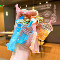 Porte-clés personnalisé en sable liquide coloré pour femmes, mignon pendentif en forme de sucette, bouteille à dérive, petite poupée pour sac à dos, cadeau