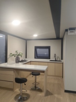 Conteneur pliant de luxe à conception modulaire 20 pieds, avec panneaux sandwich PU isolés, durable, pour maison, bureau ou bâtiment mobile