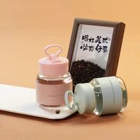 Bouteille d'eau en verre de 300 ml avec couvercle créatif intégrant un support pour téléphone et manchon en cuir isolant, mini-gobelet à lait portable