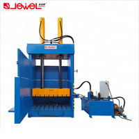 Presse à balles hydraulique verticale semi-automatique à haute efficacité pour le recyclage des déchets de balles de pneus automobiles de véhicules en caoutchouc usagés