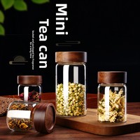 Vente en gros de récipient de stockage des aliments en verre borosilicaté à haute teneur en borosilicate cylindre de bocal transparent avec couvercle en acacia
