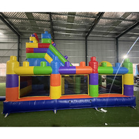 Château gonflable commercial en PVC pour enfants, avec toboggan intégré, idéal pour les fêtes