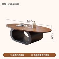 Table basse en bois massif de noyer avec un design minimaliste moderne, forme ovale, pour le salon