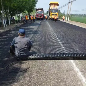 Mặt đất sỏi lưới paver nhựa đường gia cố sợi thủy tinh geogrid 100-100kn cho xây dựng đường bộ