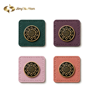 Étiquettes en cuir cousues sur mesure Jinyi pour hijabs, abayas, sacs et vêtements – Fabrication OEM/ODM
