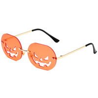 Pas cher 2024 New Halloween citrouille lunettes de soleil irrégulières sans monture danse fête lunettes de soleil tendance