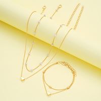 Ensemble de bijoux élégant à double couche de perles empilées en forme de cœur, bracelet et collier en or et argent