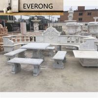 Table de jardin en marbre blanc avec banc