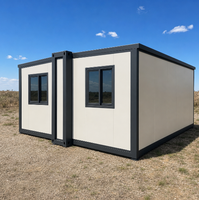 Maison conteneur pliable extensible Off-White avec cadre foncé pour le glamping et le bureau de chantier