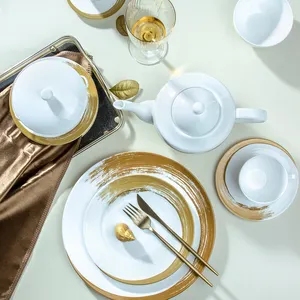 Vajilla de porcelana nórdica para restaurante, juegos de platos de lujo con borde dorado y cerámica blanca, venta al por mayor