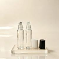 Vente en gros de flacons en verre transparent de 10 ml avec bille interchangeable pour pompe pulvérisatrice, flacon vide pour parfum/huile essentielle, conteneur cosmétique personnalisé