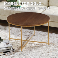 Table basse moderne en marbre avec plateau en acier inoxydable doré pour salon ou hôtel