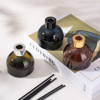 Vente en gros de flacons ronds en verre de 100 ml pour l'emballage d'huiles essentielles d'aromathérapie avec bâtonnets diffuseurs