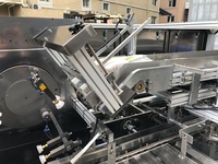 Machine d'emballage et de cartonnage pour semelles de chaussures