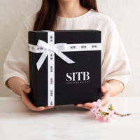 Boîte cadeau noire élégante avec nœud en ruban blanc Emballage de luxe personnalisé Conteneur en papier rigide pour produits de beauté