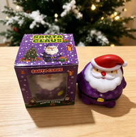 Jouet Squishy Père Noël multicolore festif et très populaire, emballé individuellement dans une boîte cadeau, idéal pour les cadeaux de Noël