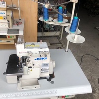 Machine à coudre surjeteuse Juki d'occasion -6704s, à plat, à grande vitesse, à commande informatique, 3 fils