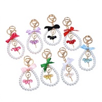 Boutons de manchette en métal style Ins avec nœud perlé, accessoire créatif fait main, porte-clés en cristal Fille de ballet pour toutes les saisons